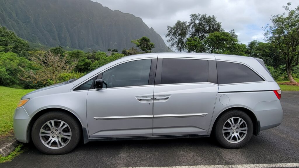 Our 2012 Honda Odyssey parked in front of the Koʻolau mountains, Oʻahu